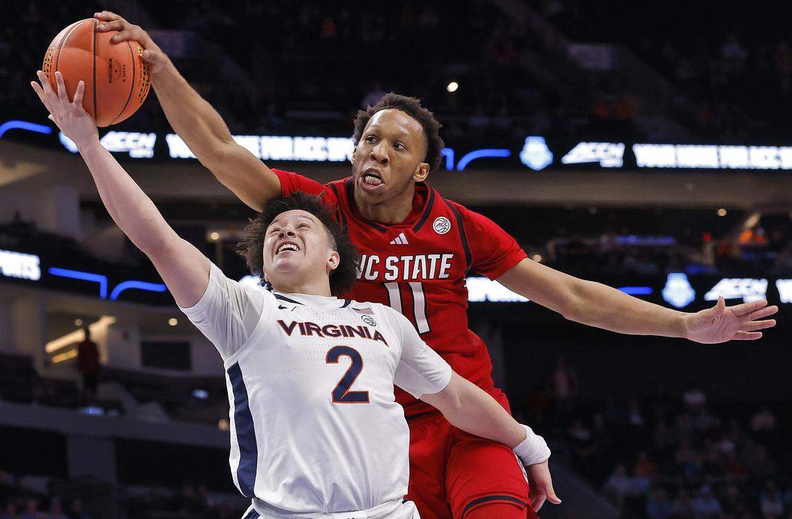 N.C. State's Quadir Copeland blocks a shot by Virginia's Chance Mallory during the second half of the Wolfpack’s 81-74 loss in the ACC Tournament quarterfinals on Thursday, March 12, 2026, at the Spectrum Center in Charlotte, N.C. 