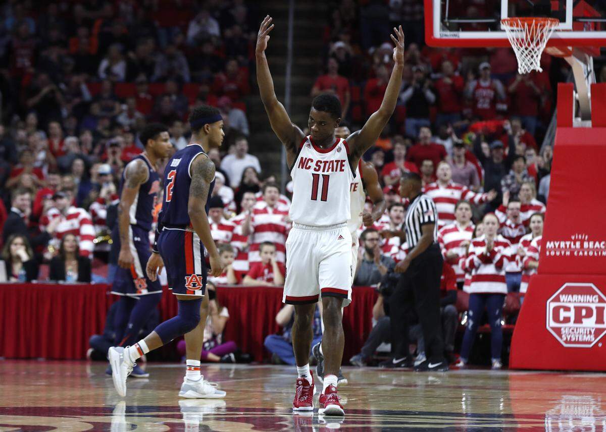N.C. State’s Markell Johnson (11) celebrates during the second half of N.C. State’s 78-71 victory over Auburn at PNC Arena in Raleigh, N.C., Wednesday, Dec. 19, 2018.