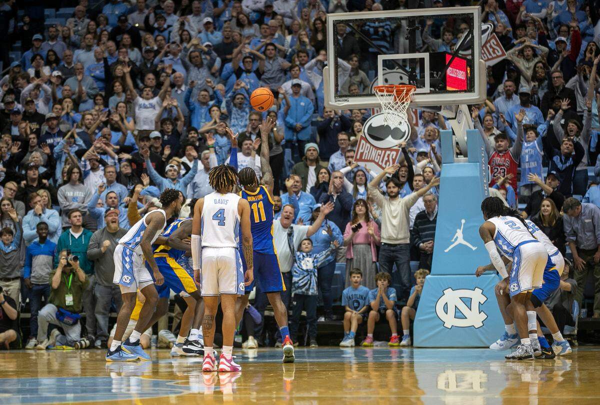 Pittsburgh’s Jamarius Burton (11) makes the second of two free throws with three seconds to play to secure the Panthers’ 65-64 victory over North Carolina on Wednesday, February 1, 2023 at the Smith Center in Chapel Hill, N.C.