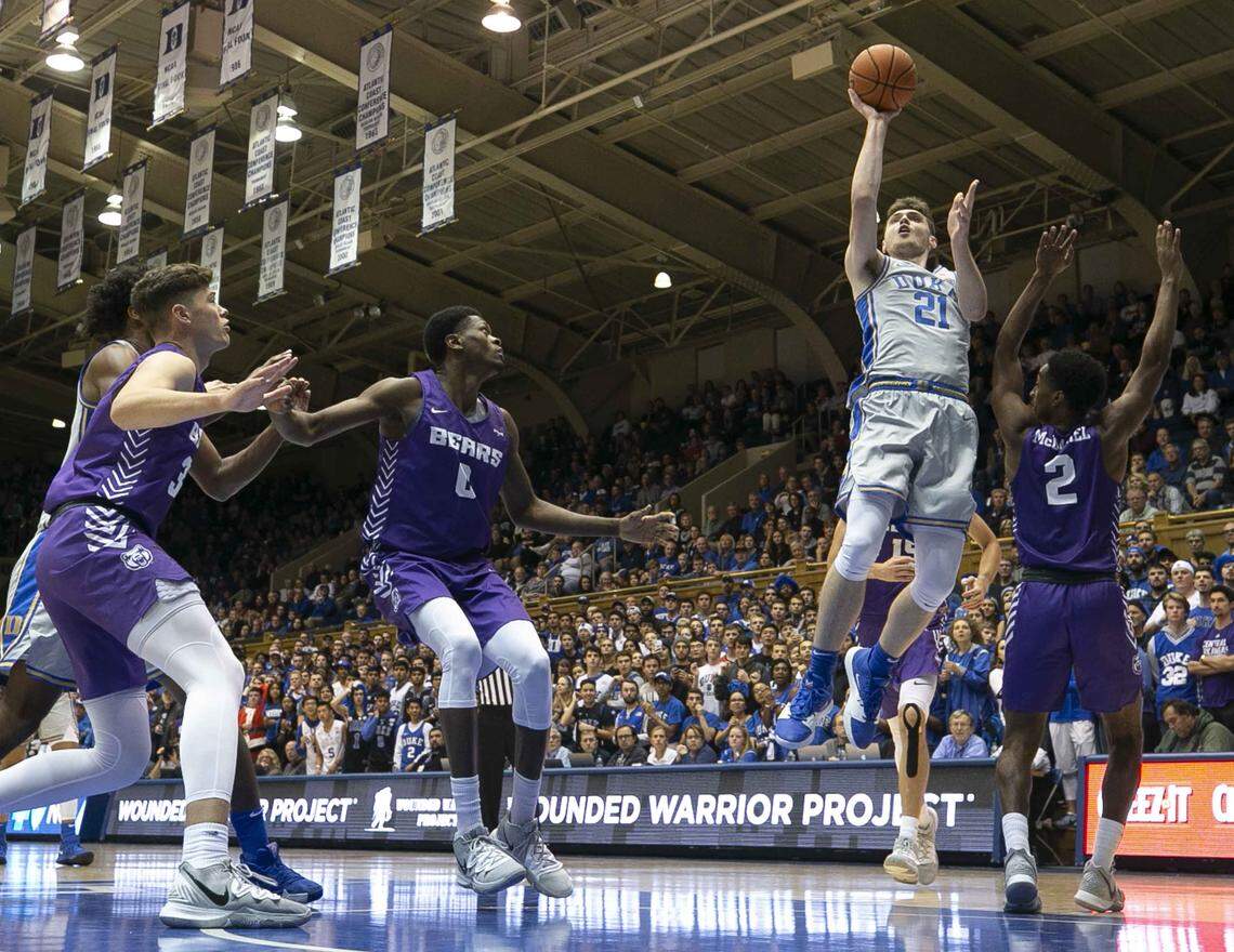 Duke’s Matthew Hurt (21) shoots over Central Arkansas’ Lewis McDaniel (2) during the first half on Tuesday, November 12, 2019 at Cameron Indoor Stadium in Durham, N.C. Hurt lead all scores with 19 points in the Blue Devils’ 105-54 victory.