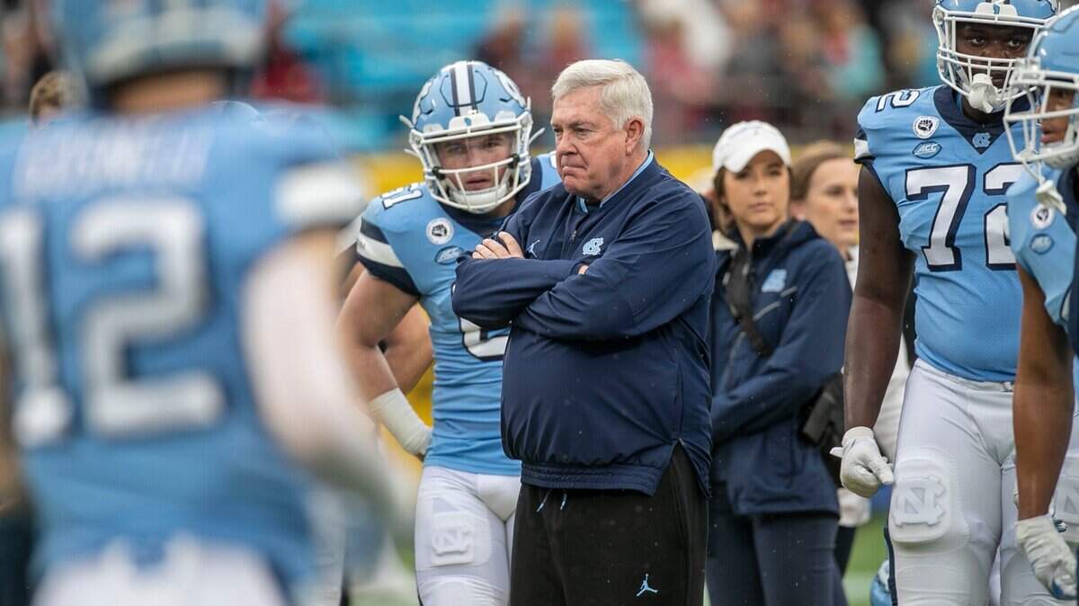 North Carolina coach Mack Brown watches his team warm up prior to their game against South Carolina in the Duke’s Mayo Bowl on Thursday, December 30, 2021 at Bank of America Stadium in Charlotte, N.C.