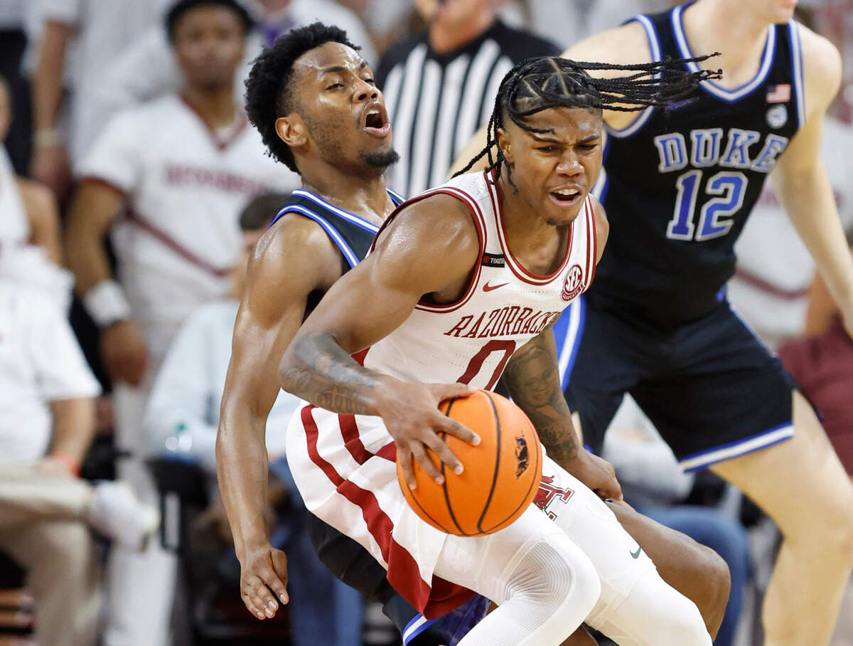 Arkansas’ Khalif Battle (0) gets around the defense of Duke’s Jeremy Roach (3) during the second half of Arkansas’ 80-75 victory over Duke at Bud Walton Arena in Fayetteville, Ark., Weds. Nov. 29, 2023.
