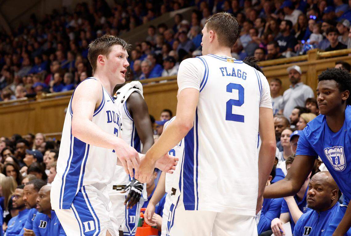 Duke’s Kon Knueppel (7) talks to Cooper Flagg (2) at the bench during the second half of Duke’s 96-62 victory over Maine at Cameron Indoor Stadium in Durham, N.C., Monday, Nov. 4, 2024.