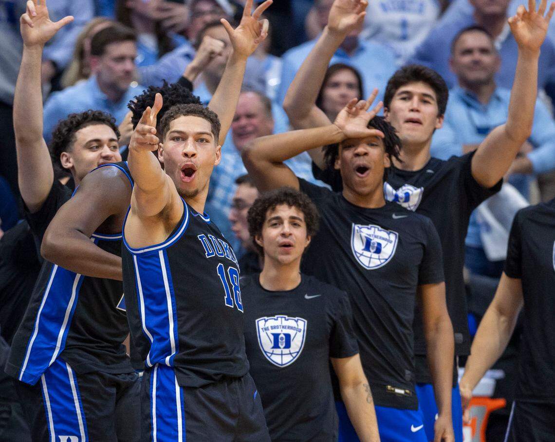 Duke’s Mason Gillis (18) and the Blue Devils bench react after teammate Maliq Brown (6) sank a three point basket in the second half against North Carolina on Saturday, March 8, 2025 at the Smith Center in Chapel Hill, N.C.