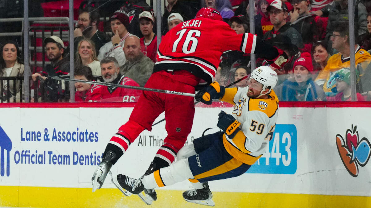 Carolina Hurricanes defenseman Brady Skjei (76) checks Nashville Predators defenseman Roman Josi (59) during the first period at PNC Arena.