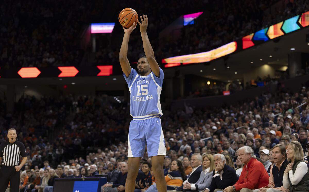North Carolina forward Jarin Stevenson (15) lines up a three-point shot to give the Tar Heels an 81-74 lead in the final minutes of play against Virginia on Saturday, January 24, 2026 at John Paul Jones Arena in Charlottesville, Va.  Stevenson scored 17 points in the Tar Heels’ 85-80 victory. 