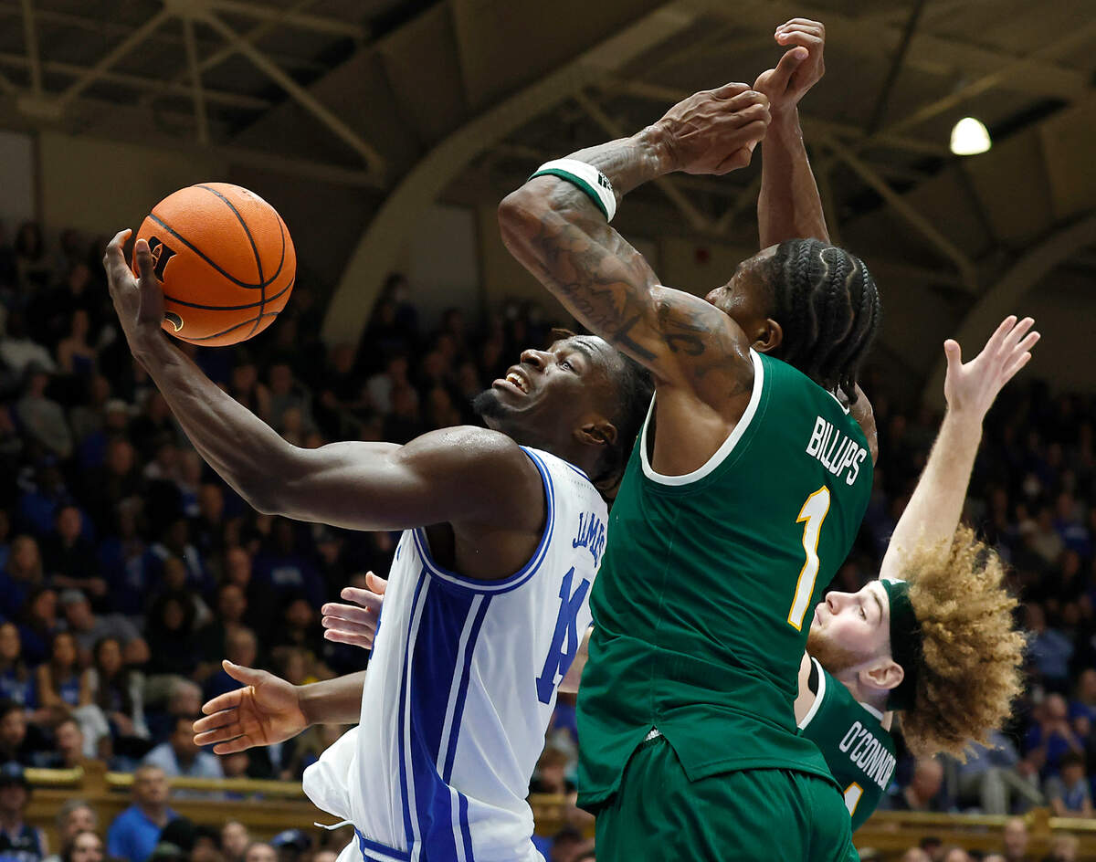 Duke’s Sion James drives to the basket past George Mason’s Jared Billups and Brayden O’Connor during the second half of the Blue Devils’ 68-47 win on Tuesday, Dec. 17, 2024, at Cameron Indoor Stadium in Durham, N.C.