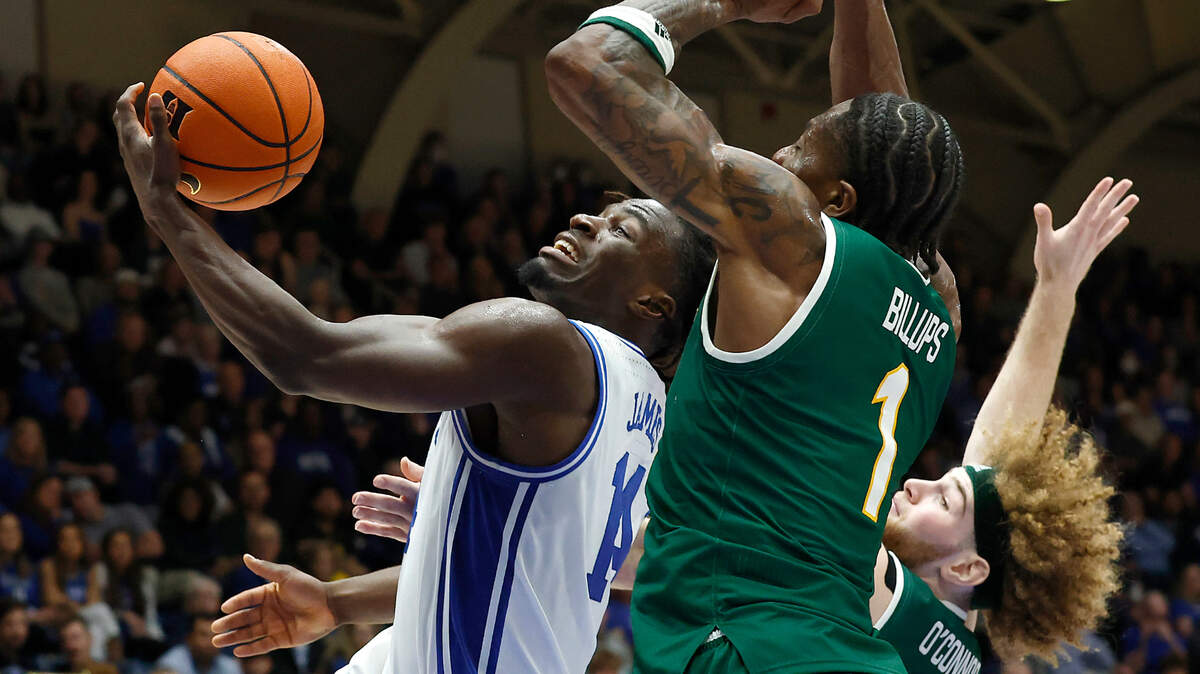 Duke’s Sion James drives to the basket past George Mason’s Jared Billups and Brayden O’Connor during the second half of the Blue Devils’ 68-47 win on Tuesday, Dec. 17, 2024, at Cameron Indoor Stadium in Durham, N.C.