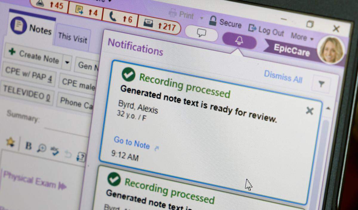 Physician assistant Sarah Garwood uses an app on her iPhone called DAX Copilot to take a recording during a patient appointment at the UNC Family Medicine at Panther Creek office. DAX Copilot then feeds the clip through a secure version Chat GPT-4, and produces paragraphs of documentation for the doctor to approve or alter on their computer. Unburdened by typing, Garwood has more time to focus on patients one on one.