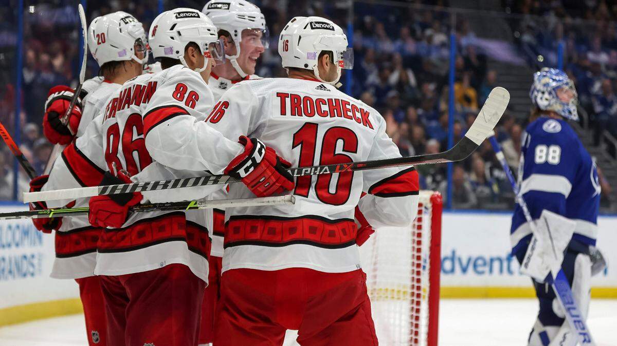Carolina Hurricanes’ Teuvo Teravainen (86), of Finland, celebrates his goal with teammates, including Vincent Trocheck, as Tampa Bay Lightning goaltender Andrei Vasilevskiy, of Russia, reacts during the third period of an NHL hockey game Tuesday, Nov. 9, 2021, in Tampa, Fla. The Hurricanes won 2-1. (AP Photo/Mike Carlson)
