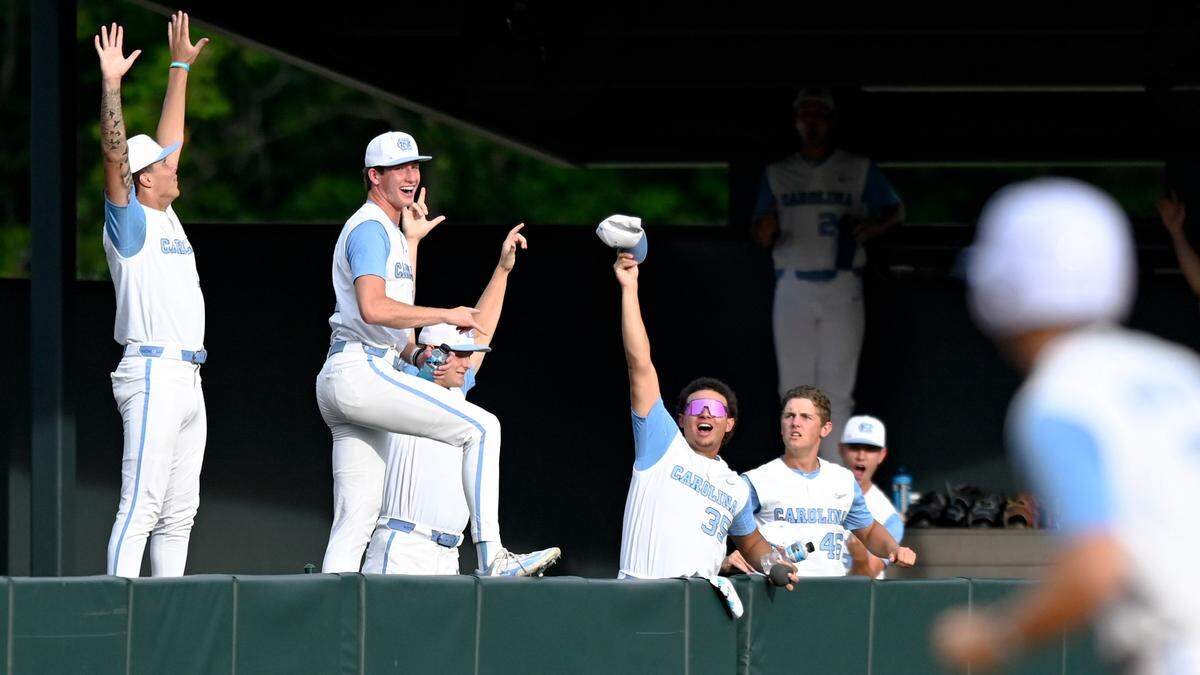 North Carolina bull pen celebrates as North Carolina’s Vance Honeycutt (7) runs past after he hit a three run home run during the fifth inning of North Carolina’s 6-2 victory against LSU in the NCAA Regional at Boshamer on Saturday, June 1, 2024.