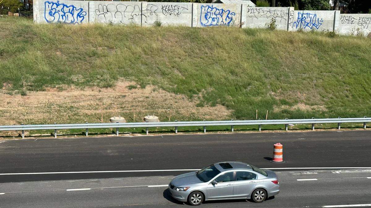 Graffiti on the new sound walls along westbound Interstate 440, the Raleigh Beltline, near the Athens Drive overpass.