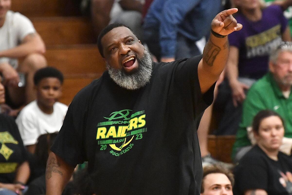 Richmond head coach Donald Pettigrew gives direction to his team during the first half of the East Regional Final. The Richmond Raiders and the Holly Springs Golden Hawks met in the NCHSAA 4A East Regional Finals in Sanford, N.C. on March 4, 2023.