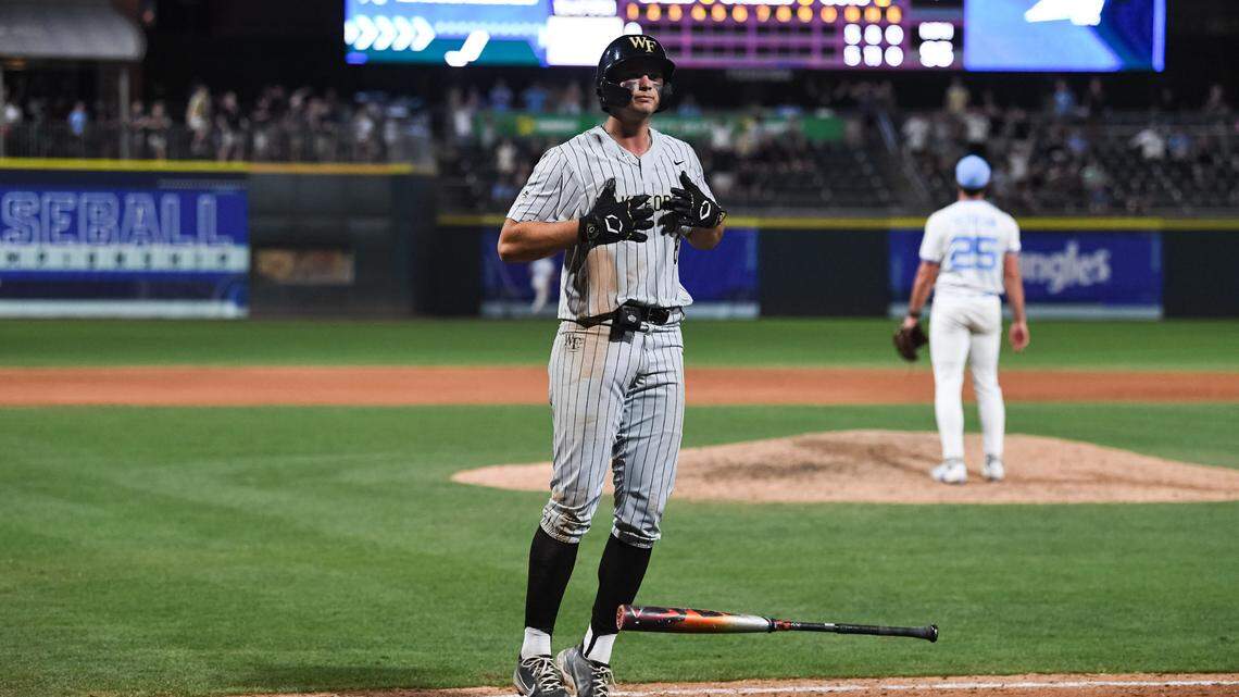 Wake Forest’s Nick Kurtz gestures to his teammates in the dugout after hitting a two-run home run in the top of the 12th inning of the Demon Deacons’ 9-5 win over North Carolina at the ACC baseball tournament Friday night in Charlotte.