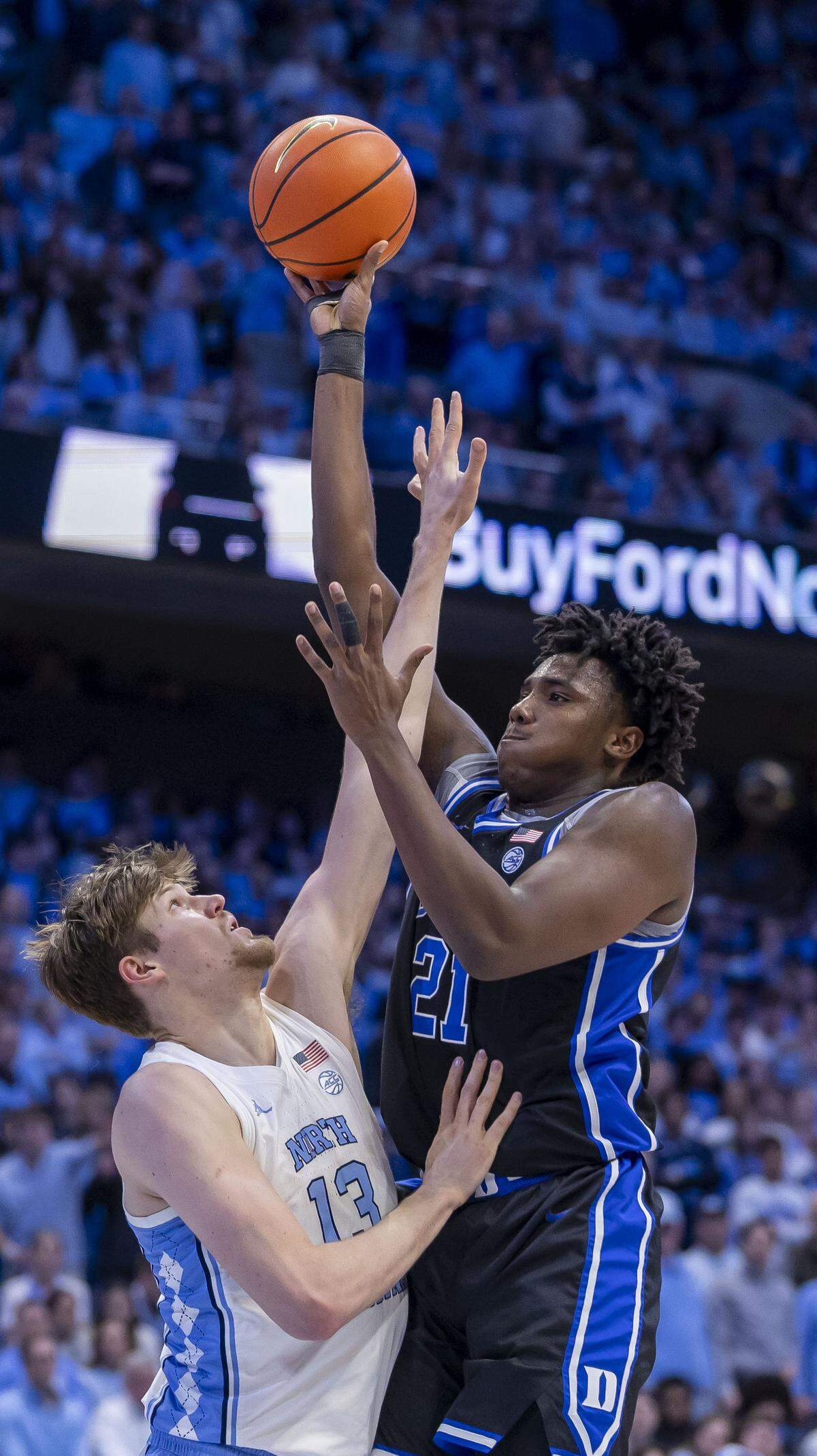 Duke center Patrick Ngongba II (21) puts up a short against North Carolina center Henri Veesaar (13) in the first half on Saturday, February 7, 2026 at the Smith Center in Chapel Hill, N.C.