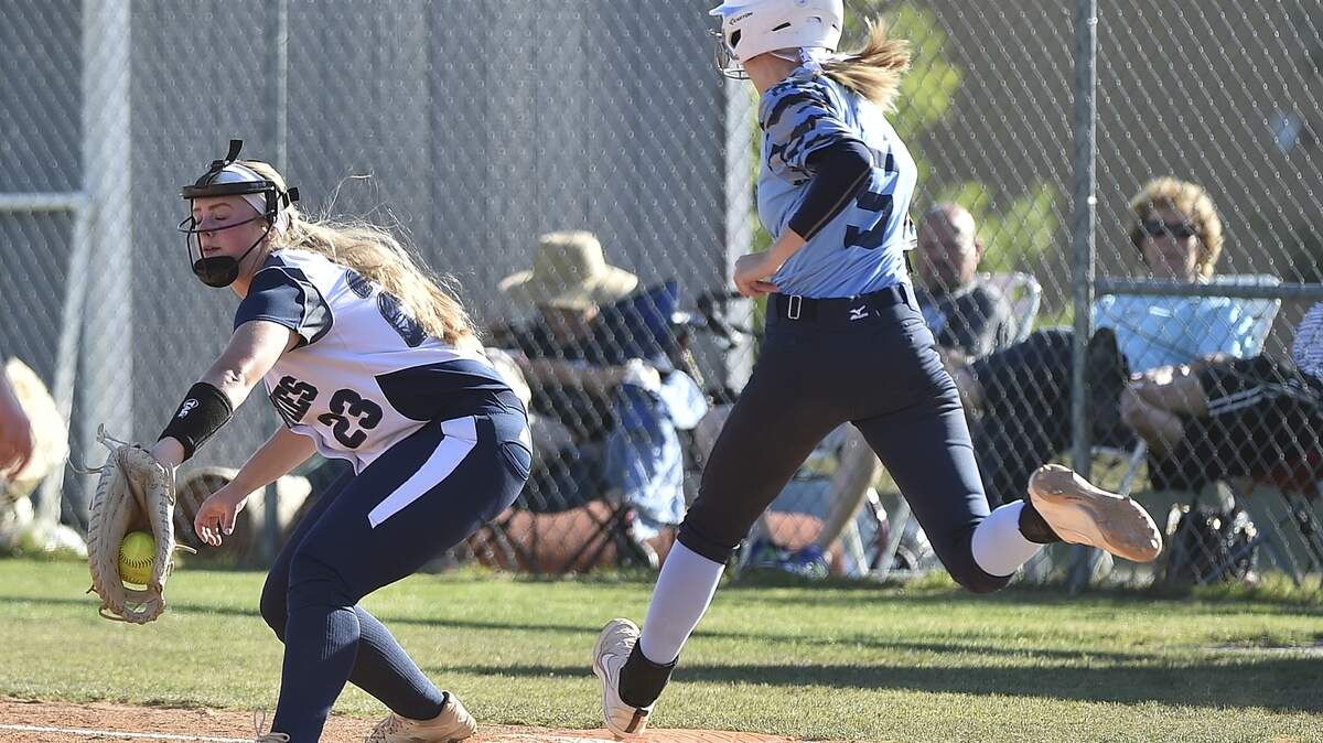 Heritage’s McKenna Glascock (23) tags out Hoggard’s Amber SMall (5) at first base. The Heritage Huskies and Hoggard Vikings met in a NCHSAA 4A softball Eastern Regional Final Playoff game in Wake Forest, N.C. on May 21, 2019.