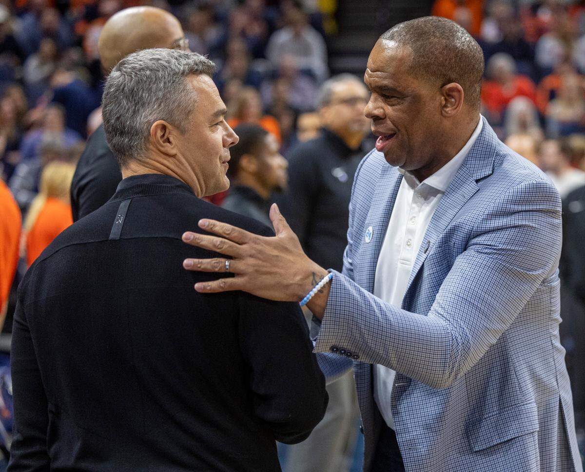 Virginia coach Tony Bennett greets North Carolina coach Hubert Davis prior to their game on Saturday, February 24, 2024 at John Paul Jones Arena in Charlottesville, Va.