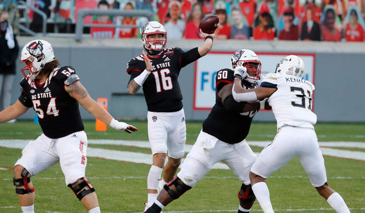 N.C. State quarterback Bailey Hockman (16) passes during the first half of N.C. State’s game against Georgia Tech at Carter-Finley Stadium in Raleigh, N.C., Saturday, Dec. 5, 2020.