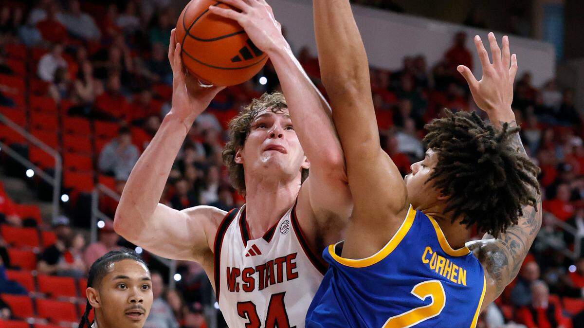 N.C. State’s Ben Middlebrooks (34) is fouled as he shoots as Pittsburgh’s Cameron Corhen (2) defends during the second half of N.C. State’s 71-63 victory over Pitt at the Lenovo Center in Raleigh, N.C., Wednesday, March 5, 2025.