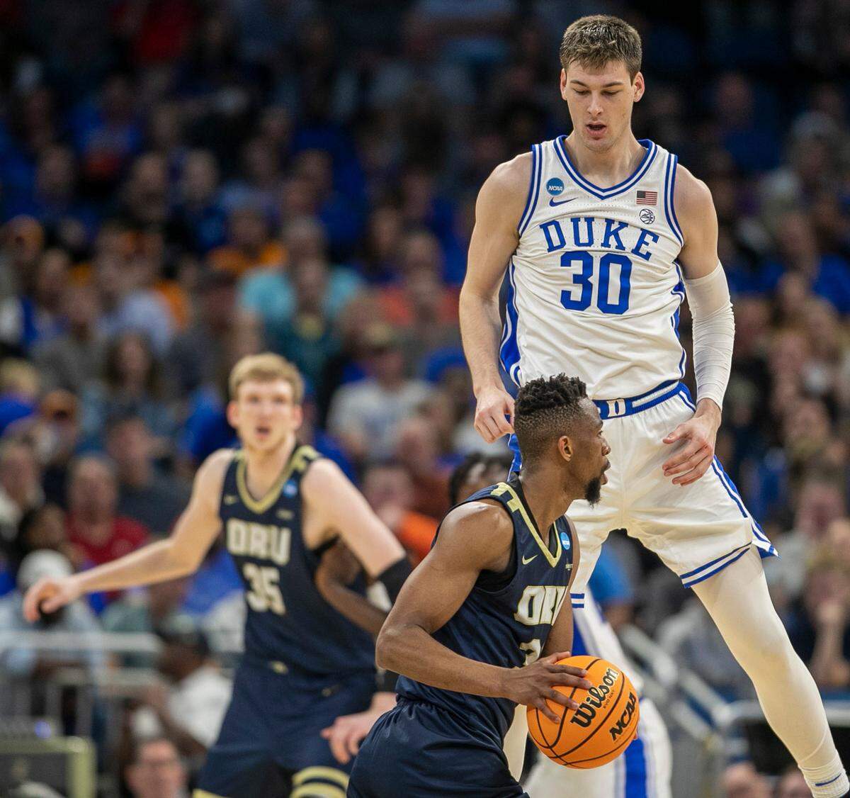 Duke’s Kyle Filipowski (30) defends Oral Roberts’ Patrick Mwamba (32) in the second half during the first round of the NCAA Tournament on Thursday, March 16, 2023 at the Amway Center in Orlando, Fla.
