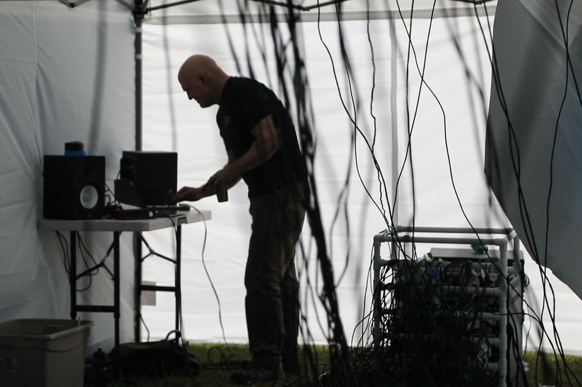 Neon artist Nate Sheaffer's tests equipment for his "Light the Woods with Sound" installation piece Saturday, May 5, 2018 at Dix Park. The interactive installation contains nearly 400 neon lights controlled by sound.