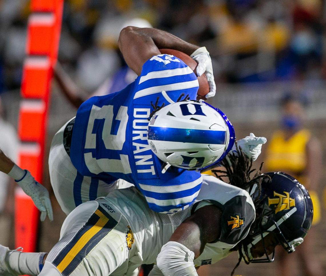 Duke’s Mataeo Durant (21) dives over North Carolina A&T’s Miles Simon (4) to score a touchdown in the second quarter on Friday, September 10, 2021 at Wallace Wade Stadium in Durham, N.C.