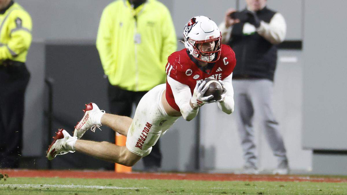 N.C. State linebacker Payton Wilson (11) intercepts the ball during the second half of N.C. State’s 39-20 victory over UNC at Carter-Finley Stadium in Raleigh, N.C., Saturday, Nov. 25, 2023.