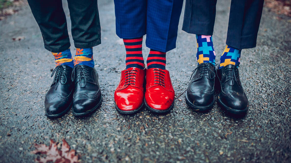 You might need to dress conservatively at work. But you can at least wear fun socks.