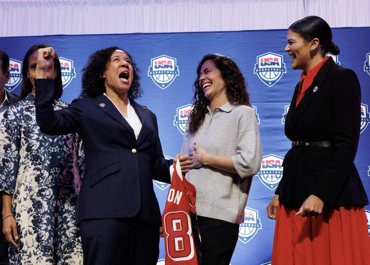 Duke women’s basketball head coach Kara Lawson shares a laugh with Sue Bird after being named the 2025-2028 USA Basketball Women’s National Team head coach during a ceremony at Cameron Indoor Stadium on Tuesday, Sept. 23, 2025, in Durham, N.C.