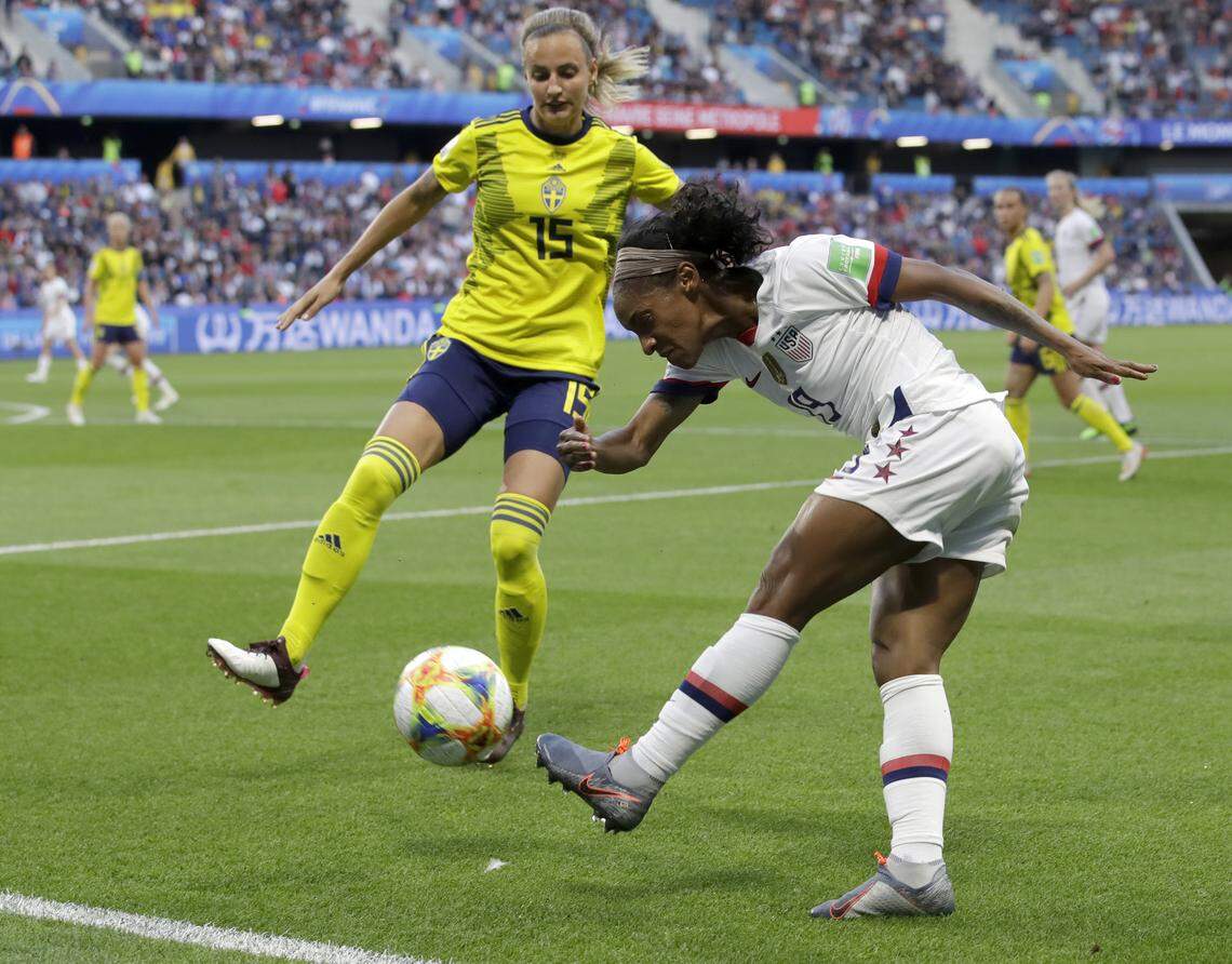United States’ Crystal Dunn, right, kicks the ball as Sweden’s Nathalie Bjorn attempts to block the shot during the Women’s World Cup Group F soccer match between Sweden and the United States at Stade Océane, in Le Havre, France, Thursday, June 20, 2019. (AP Photo/Alessandra Tarantino)