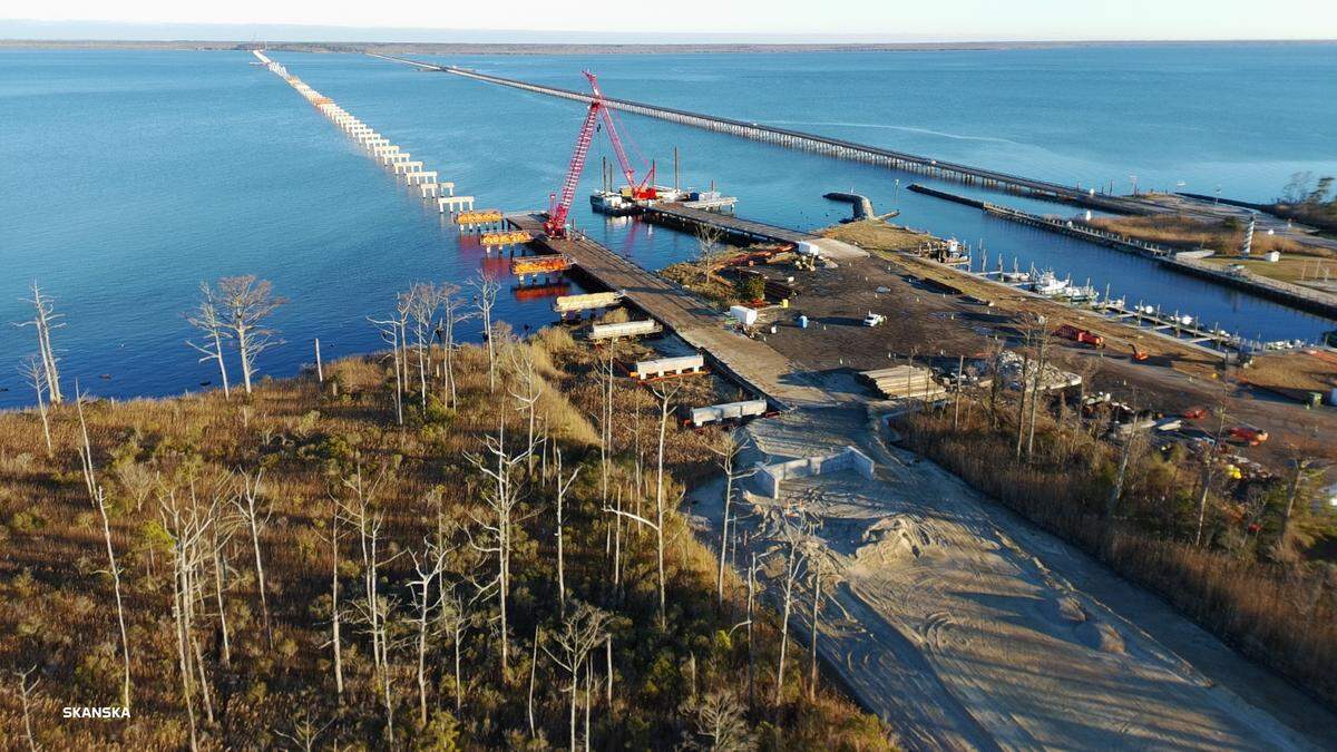 The concrete supports for the new bridge over the Alligator River stretch out to the left just north of the existing Lindsay C. Warren Bridge that carries U.S. 64 between Dare and Tyrrell counties. Photo taken in January 2026.