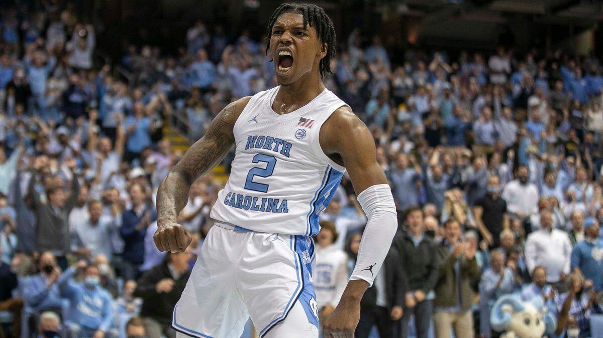North Carolina’s Caleb Love (2) reacts after a dunk to give the Tar Heels’ an early lead over Michigan during the first half on Wednesday, December 1, 2021 at the Smith Center in Chapel Hill, N.C.