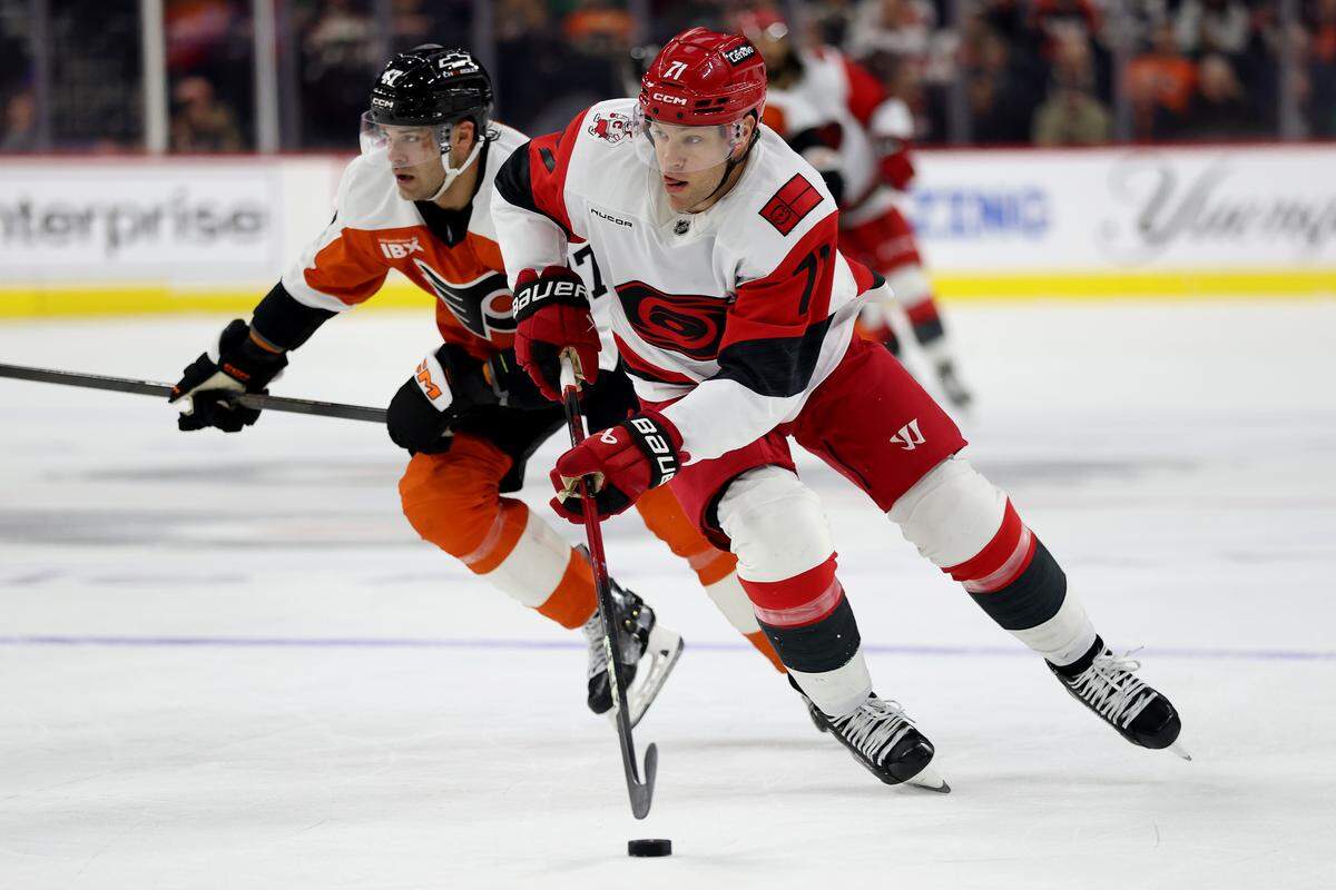 Taylor Hall (71) of the Carolina Hurricanes controls the puck during the first period against the Philadelphia Flyers at Xfinity Mobile Arena on Dec. 13, 2025 in Philadelphia, Pennsylvania.