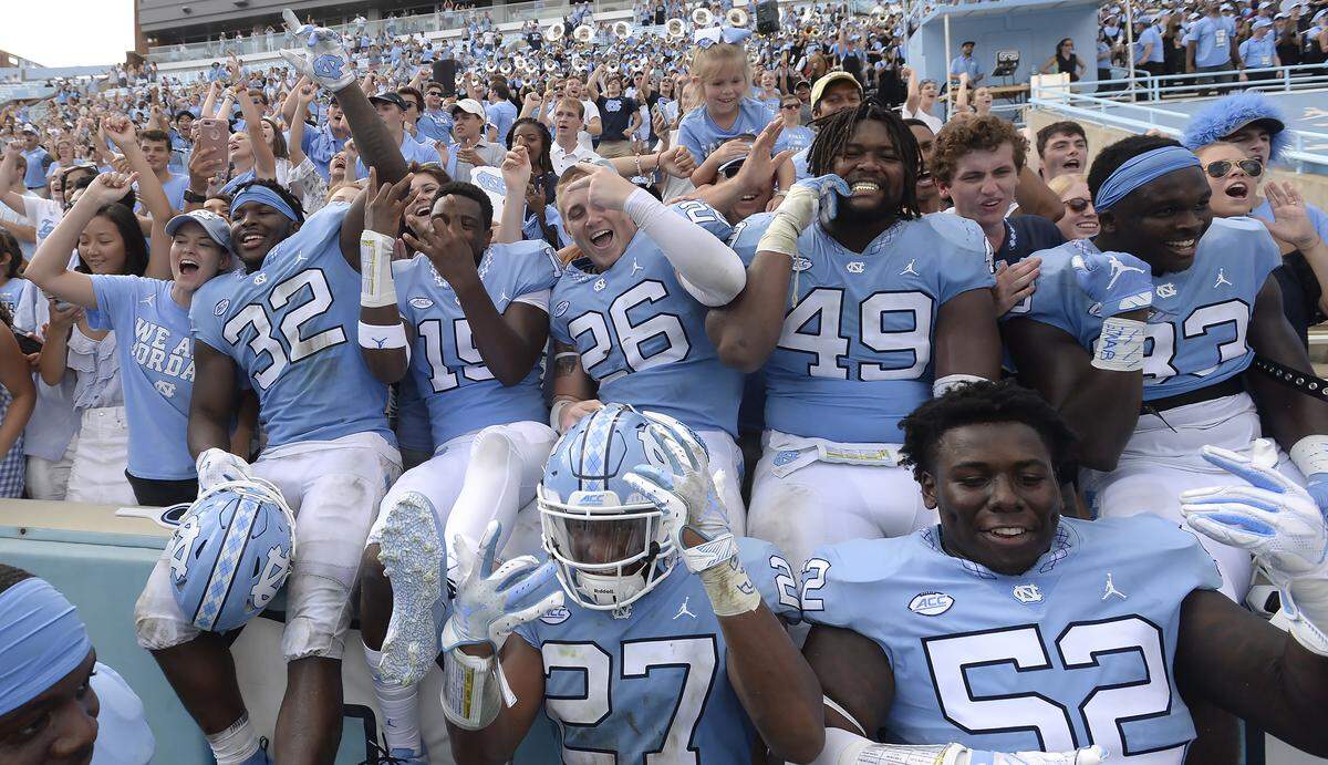 Tar Heel football players celebrate with their fans as UNC won their first game of the season 38-35 over Pittsburgh in Chapel Hill, N.C. Saturday, Sept.22, 2018.