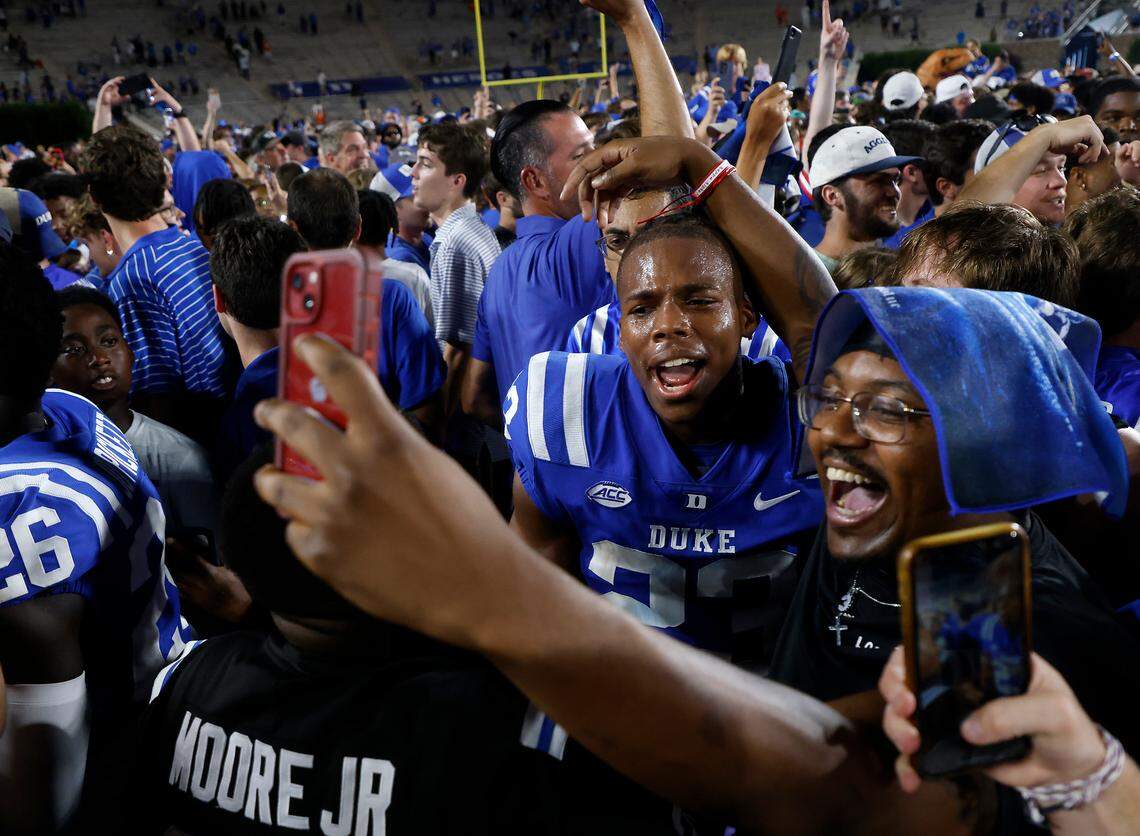 Duke players, students and fans celebrate on the field following the Blue Devils’ 28-7 win over Clemson on Monday, Sept. 4, 2023, at Wallace Wade Stadium in Durham, N.C.