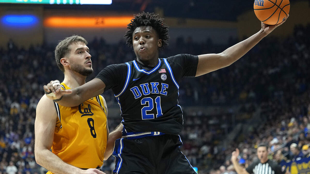 Patrick Ngongba II (21) of the Duke Blue Devils is guarded by Milos Ilic (8) of the California Golden Bears in the first half at Haas Pavilion on January 14, 2026 in Berkeley, California.