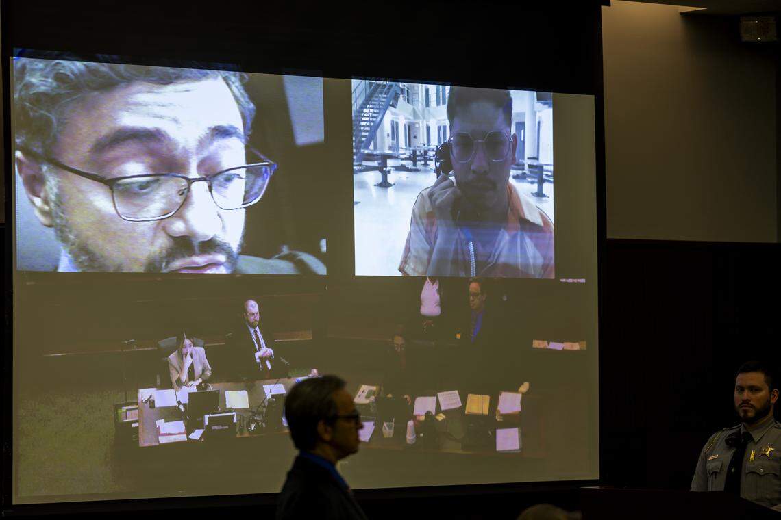 Brayan Alvarez Ortiz, 28, top right,makes his first appearance in Wake County District Court via a video feed from jail on Thursday, Dec. 11, 2025, where he is being held without bond. Ortiz, a UNC Rex Hospital nurse, is accused of sexually assaulting patients who were recovering from surgery.