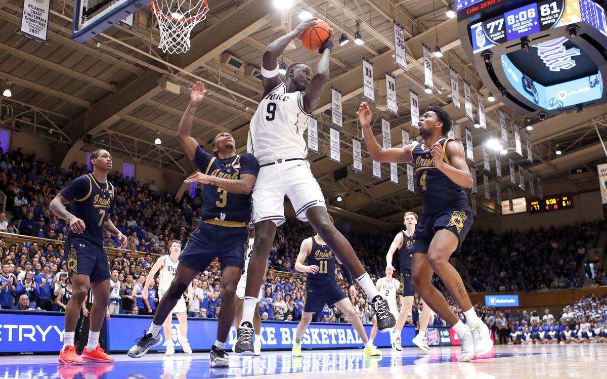 Duke’s Khaman Maluach (9) pulls in the rebound in front of Duke’s Isaiah Evans (3) and Sir Mohammed (4) during Duke’s 86-78 victory over Notre Dame at Cameron Indoor Stadium in Durham, N.C., Saturday, Jan. 11, 2025.