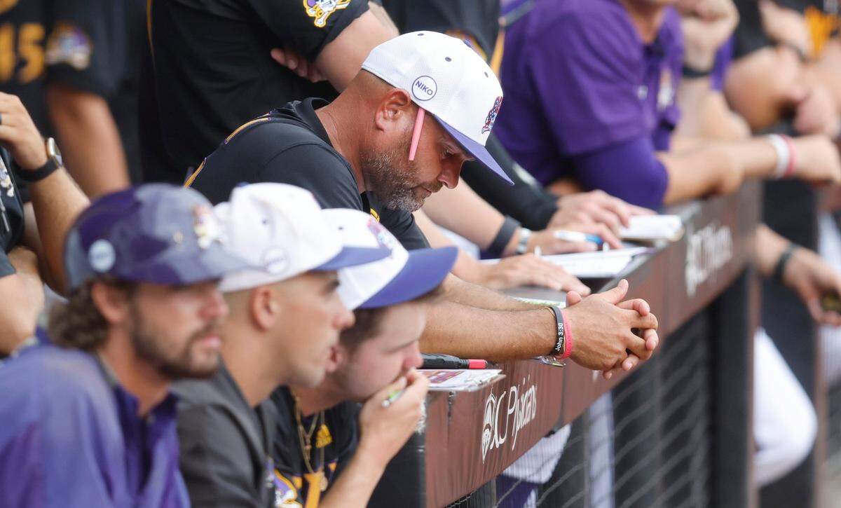 East Carolina coach Cliff Godwin watches in the first inning during ECUs game against Texas in the Greenville Super Regional at Clark-LeClair Stadium Sunday, June 12, 2022.