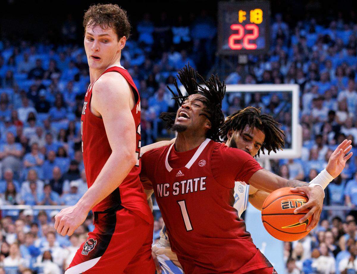 N.C. State’s Jayden Taylor drives past North Carolina’s RJ Davis during the second half of the Wolfpack’s 79-70 loss to North Carolina on Saturday, March 2, 2024, at the Smith Center in Chapel Hill, N.C.