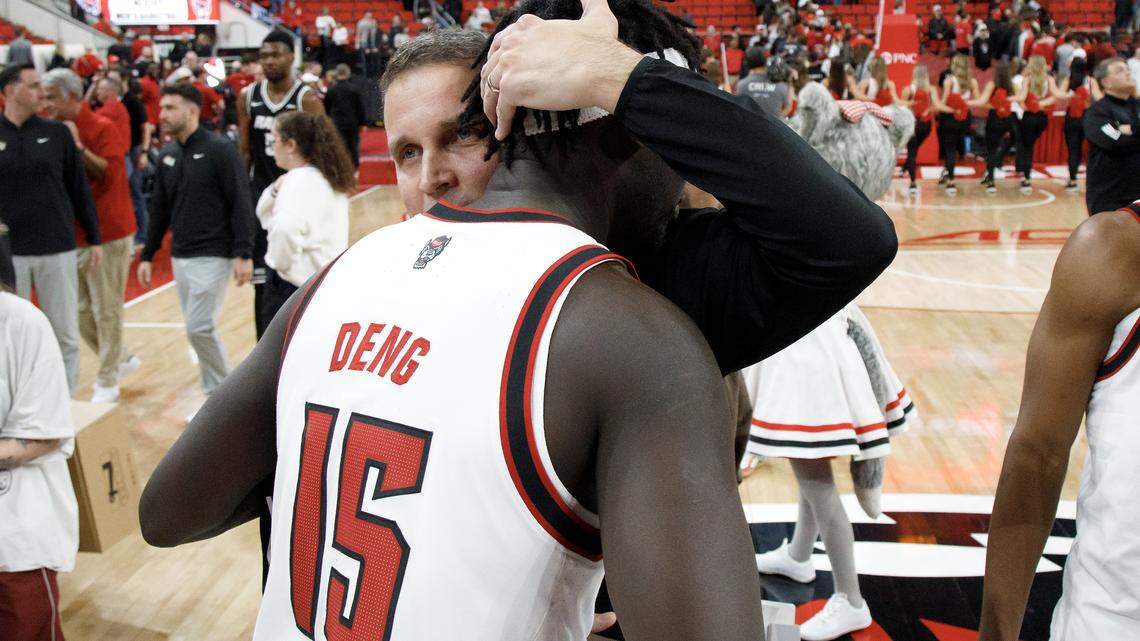 N.C. State head coach Will Wade hugs Jerry Deng following the Wolfpack’s 85-79 win over VCU on Monday, Nov. 17, 2025, at the Lenovo Center in Raleigh, N.C.