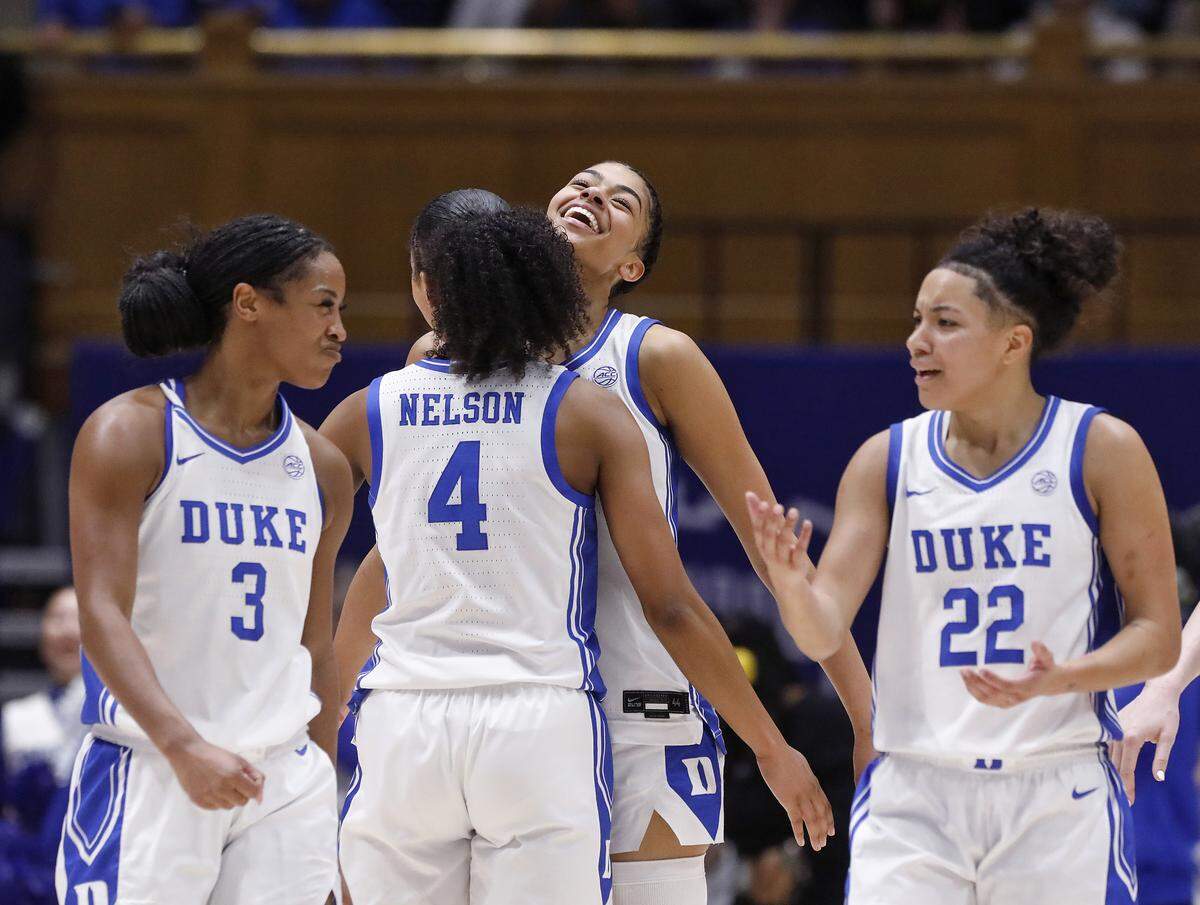 Duke’s Riley Nelson and Arianna Roberson, center, react during the second half of the Blue Devils’ 83-65 win over N.C. State on Thursday, Feb. 19, 2026, at Cameron Indoor Stadium in Durham, N.C.