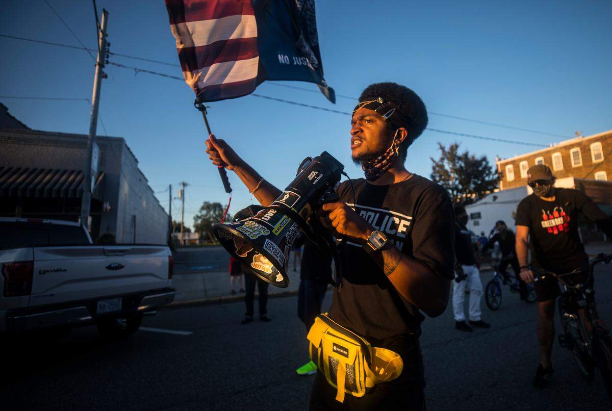 Haikoo X, a demonstrator, addresses a crowd of protesters after Graham police officers prevented them from marching to the Alamance County Historic Courthouse in Graham on Sept. 26, 2020.