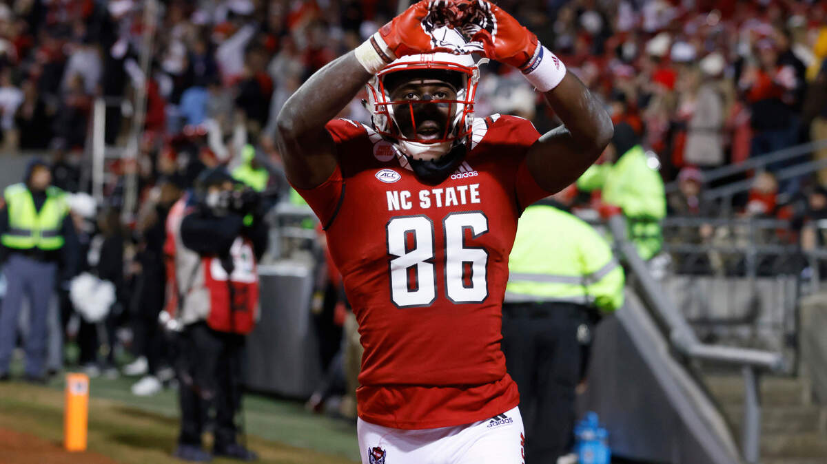 N.C. State wide receiver Emeka Emezie (86) celebrates after making what would be the game winning touchdown reception late in the second half of N.C. State’s 34-30 victory over UNC at Carter-Finley Stadium in Raleigh, N.C., Friday, November 26, 2021.