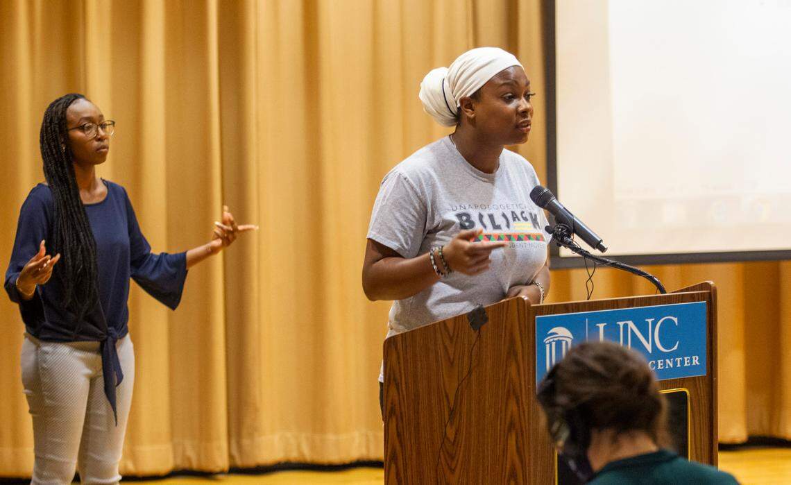 De’Ivyion Drew, UNC-Chapel Hill senior and community activist, right, speaks as Taliajah “Teddy” Vann, president of the campus Black Student Movement, snaps her fingers in approval, during a press conference hosted by the Black Student Movement, the Carolina Black Caucus and the Black Graduate and Professional Student Association Wednesday, July 7, 2021at UNC Chapel Hill’s Sonja Haynes Center. Student leaders and activists discussed Nikole Hannah-Jones’s decision to turn down UNC-Chapel Hill’s offer as Knight Chair for Race and Investigative Journalism with tenure as well safety concerns for Black students and a list of demands for the future of UNC’s Black Community.
