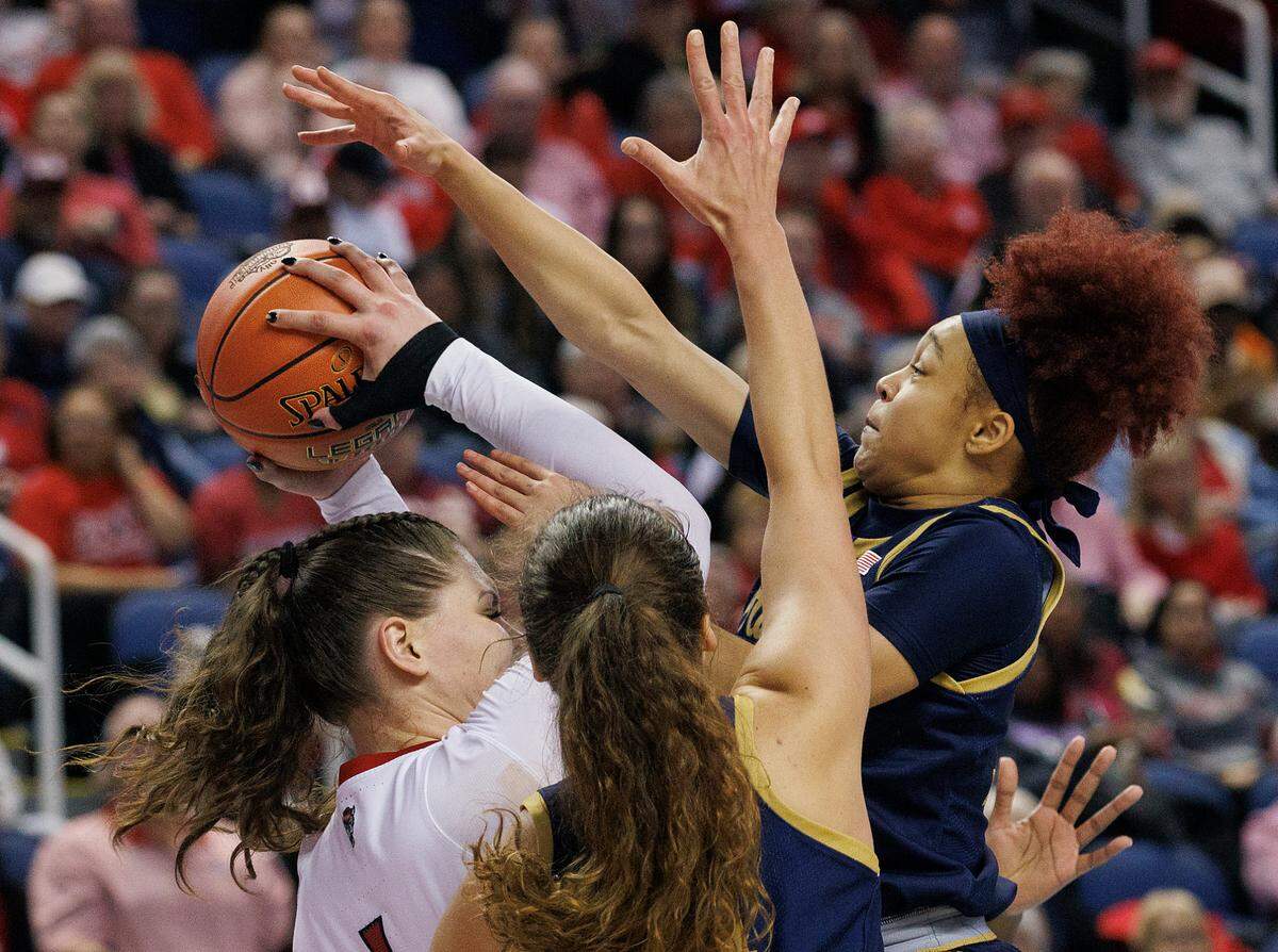 Notre Dame’s Hannah Hidalgo and Notre Dame Fighting Irish forward Maddy Westbeld trap N.C. State’s River Baldwin during the second half of the Wolfpack’s 55-51 loss in the ACC Tournament final on Sunday, March 10, 2024, at Greensboro Coliseum in Greensboro, N.C.