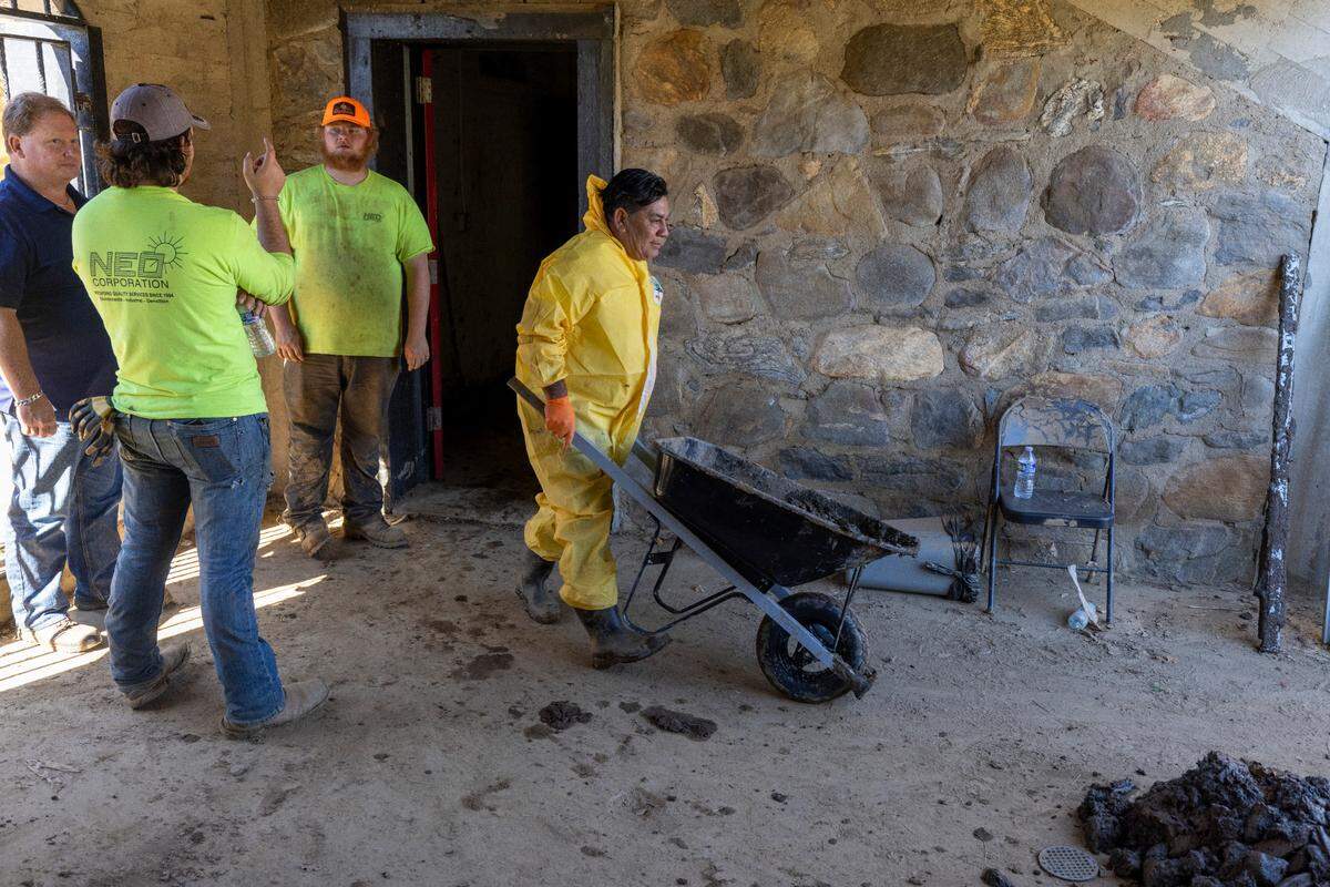 Contractors continue their clean-up of Pisgah Memorial Stadium on Friday, October 18, 2024 in Canton, N.C. The stadium has been closed since historic flooding from Hurricane Helene, three weeks ago.