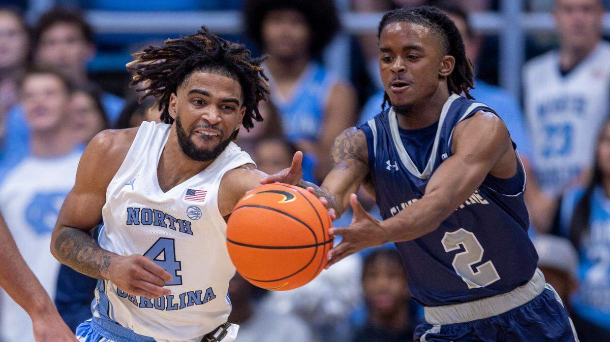 North Carolina’s R.J. Davis (4) makes a steal from St. Augustine’s Joshua Johnson (2) in the first half on Friday, October 27, 2023 at the Smith Center in Chapel Hill, N.C.
