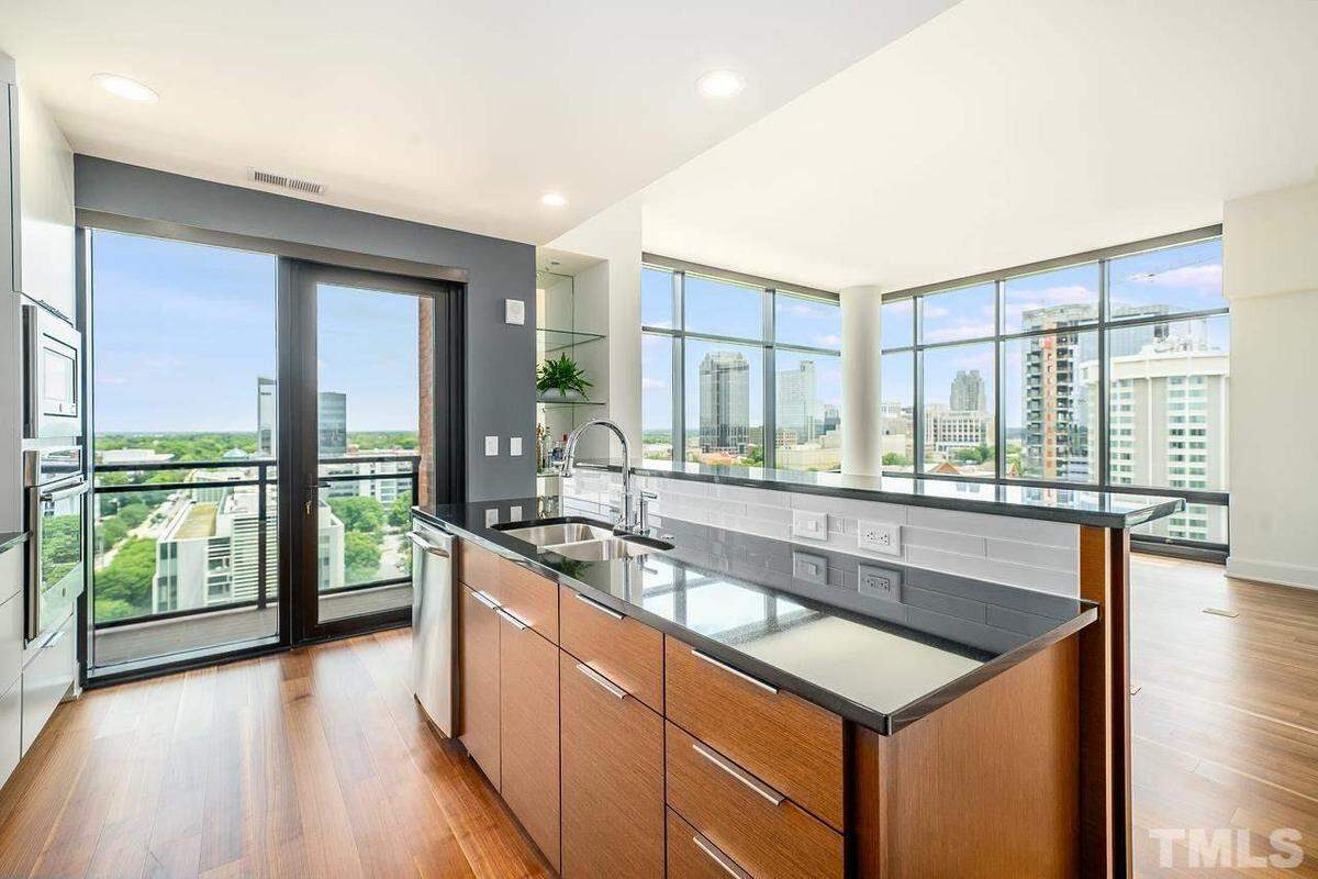 Three-bedroom, three and a half-bathroom condominium with 2,301 square feet located in the 15-story Quorum Center Condos tower at 122 N. Harrington Street, Unit 1045 in Raleigh.