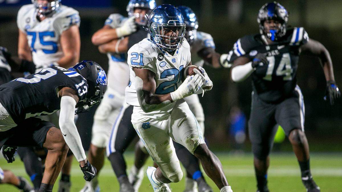 North Carolina’s Elijah Green (21) scores a touchdown on a 20-yard run in the third quarter against Duke on Saturday, October 15, 2022 at Wallace-Wade Stadium in Durham, N.C.